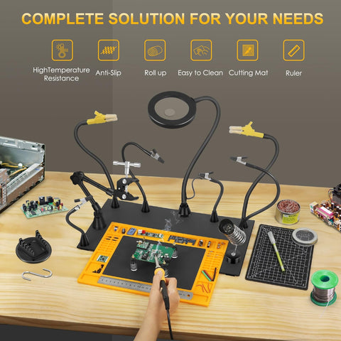 Heavy-Duty Soldering Station With Magnetic Third-Hand Rig, Non-Slip Silicone Pad, Steel Base, multiple accessories on table.