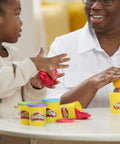 Child and adult playing with red and yellow Play-Doh in 3 Oz tin cans from Ultimate Super Bulk Haul Of Non Toxic Modeling Compound 36 Bright Shades.