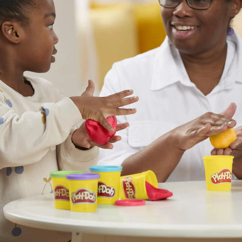 Child and adult playing with red and yellow Play-Doh in 3 Oz tin cans from Ultimate Super Bulk Haul Of Non Toxic Modeling Compound 36 Bright Shades.