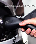 Hand using Level 1 And Level 2 Portable EV Charger With Dual Plugs NEMA 5-15 And NEMA 14-50, 240V 40 Amp Input on J1772 EV, Black.