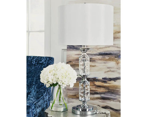 Big Glam Crystal Bead Table Lamp With Clear Glass Tubes And Shiny Chrome Finish displayed with a white hardback drum shade