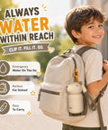A child smiling with a Snag This On The Fly Mini Insulated Water Bottle Featuring Double Wall Vacuum Seal Technology clipped to a backpack.