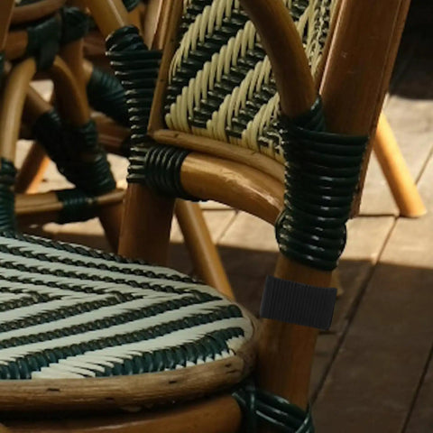 Rattan chair with black clip securing sections, showcasing 4 Pack Sectional Sofa Clips And Patio Furniture Fasteners Lightweight Wicker Rattan Couch Clamps Easy Connectors For Outdoor Sofa Sections Secure Durable Clamp Set For Tight No Fuss Bonding.