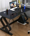 Game Ready Multifunctional Computer Desk With Built In Phone And Drink Slots curved gaming table, matte black, 63 inches wide, modern workspace.