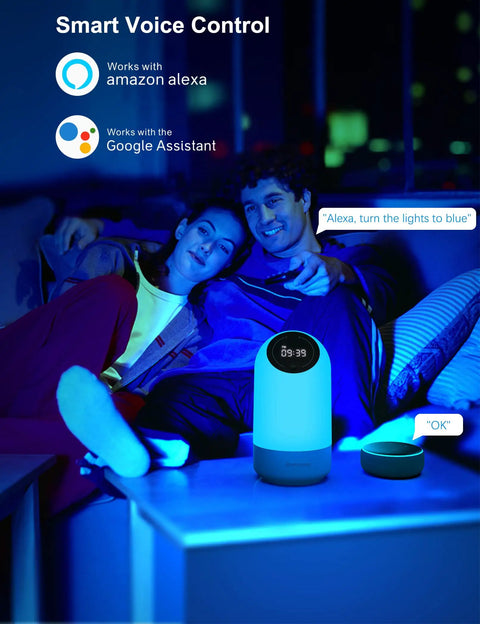Smart LED Night Light With Alexa And Google Voice Control Dimmable Bedside Table Lamp Lit Color Changing Mood Light 34 Scene Modes Built In Clock Easy Voice Control Perfect Gift For Kids Teens Adults on bedside with couple using voice commands.