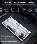 Slick Pro Wireless Aluminum 75 Percent Mechanical Keyboard With Custom LCD Display Gateron Zero Switches And Killer RGB Lighting For Your Daily Driver Rig on a desk with devices.