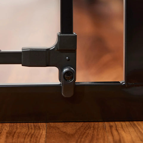Close-up of latch on extra wide baby gate 29 to 49 inches for doorways and stairs, pressure mounted safety gate with door, black