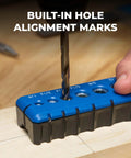 Close-up of Kreg portable drilling guide in blue and black, with a drill bit entering a hole in a wooden workpiece.