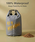 10L Dog Food Travel Bag With Collapsible Bowls For On-The-Go Kibble, 42 Cup Capacity, shown waterproof with spilled kibble