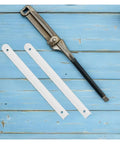 Rock Solid Side Mounted Double Row Ball Bearing Drawer Slides Heavy Duty Three Stage Triple Extension Cold Rolled Steel Smooth As Butter Quiet Glide For Cabinets Includes Three Sets Built To Last - metal tool and white brackets on blue wood.