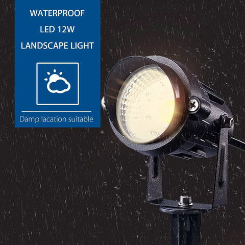 Ultra Bright 12W LED Landscape Lights Low Voltage 12V Waterproof shown in rain with spike stand