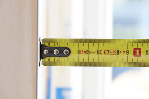 Close-up of Fatmax Tape Measure With Blade Armor And Dual Scale 8m Length extended, showing dual scale and 3.35mm standout