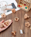8 Piece Flower Wood Cabinet Knobs Set In Burlywood Two Sizes Cute Floral Drawer Pulls on a table with accessories.