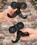 Heavy Duty Kickass Cast Iron Mustache Wall Hooks held in hands showing beard shapes, ideal for coat and towel storage.