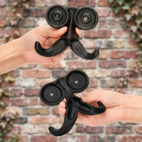 Heavy Duty Kickass Cast Iron Mustache Wall Hooks held in hands showing beard shapes, ideal for coat and towel storage.