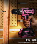 Pink Cordless Drill Kit With Battery And Charger, 20V Electric Power Drill For Women in use on a wooden plank