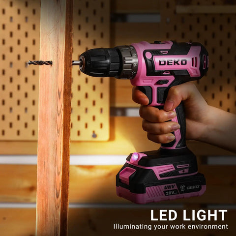 Pink Cordless Drill Kit With Battery And Charger, 20V Electric Power Drill For Women in use on a wooden plank
