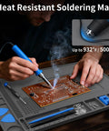 Person soldering on Heat Resistant Soldering Mat For Electronics Repair, Pro Grade Magnetic Silicone Work Pad With 110 Compartments