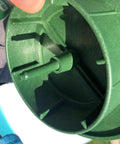 Close-up of green plastic Pop Up Drainage Emitter With Elbow For 4 Inch Drain Pipe showing internal parts and design