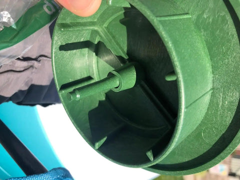 Close-up of green plastic Pop Up Drainage Emitter With Elbow For 4 Inch Drain Pipe showing internal parts and design