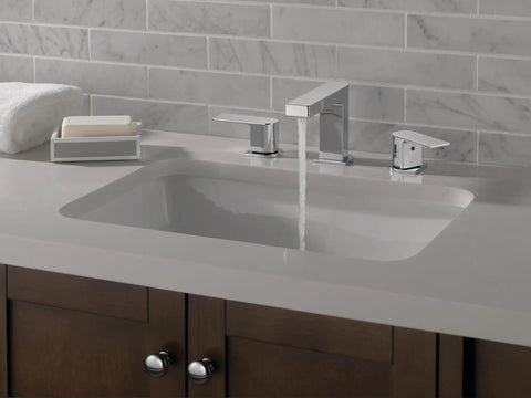 Xander Widespread Chrome Bathroom Faucet For Three Hole Six To Sixteen Inch Setup with water flowing into modern sink