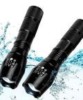 Beast Mode LED Flashlight Set, 2 Pack Small Tactical Lights with Zoomable Lens and waterproof feature shown in splash