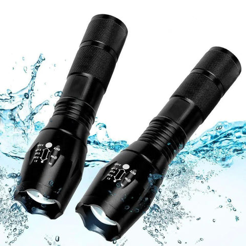 Beast Mode LED Flashlight Set, 2 Pack Small Tactical Lights with Zoomable Lens and waterproof feature shown in splash
