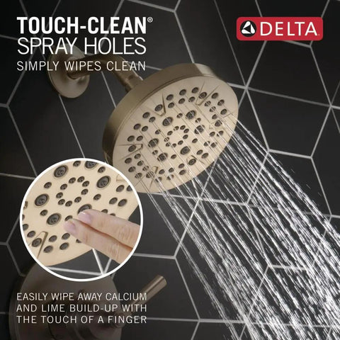 Saylor 14 Series Five Setting Shower Faucet Trim Kit with brushed gold shower head in use, showing water flow and touch-clean feature