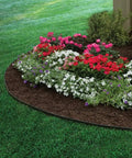 Flower bed bordered by 2 Inch Tall Landscape Edging Kit With 20 Ft Coil And 20 Spikes For Lawn Garden Borders Durable Black Plastic Edging.