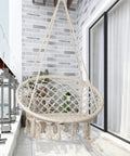 LED Macrame Hammock Chair For Indoor And Outdoor Use, Handmade cotton rope swing, installed on a patio, large 55x75 cm seat.