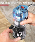 Person using Compact Wood Router Kit with 6.5 Amp 1.25 HP Power 32000 RPM Handy Beginner Friendly DIY Trim Router on wood surface