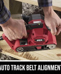 Beast 6 Amp Belt Sander with Auto Track Alignment used on wood, showing auto track feature and pressure control.
