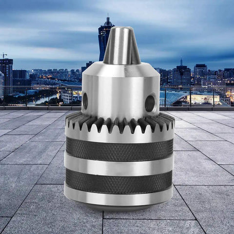 Close-up of Heavy Duty Keyed Drill Chuck Set 1/8 to 5/8 Inch Capacity, 3-16mm, 1/2-20 UNF Mount, Includes Key, against cityscape
