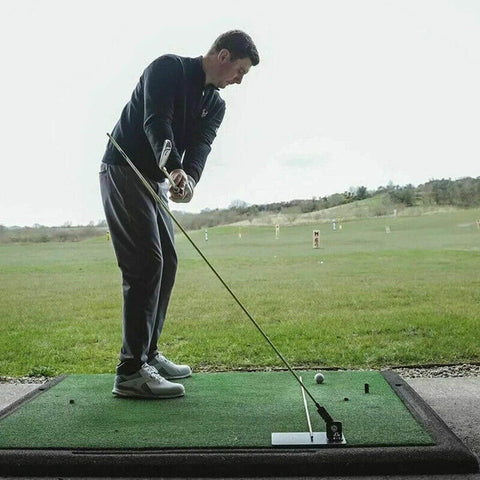 Man using Durable Steel Golf Swing Plane Trainer Plate With Alignment Stick Holder on driving range