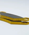 Polaris Sportsman ceramic brake pad set for ATV, front & rear, yellow backing plates with gray friction, side view
