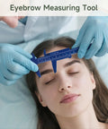 Person using blue plastic vernier caliper as an eyebrow measuring tool, highlighting precise measurement for beauty application.