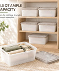 Crushing Clutter Game Changer Heavy Duty Plastic Storage Totes With Secure Snap On Lids 6 Pack displayed with stacked bins holding towels.
