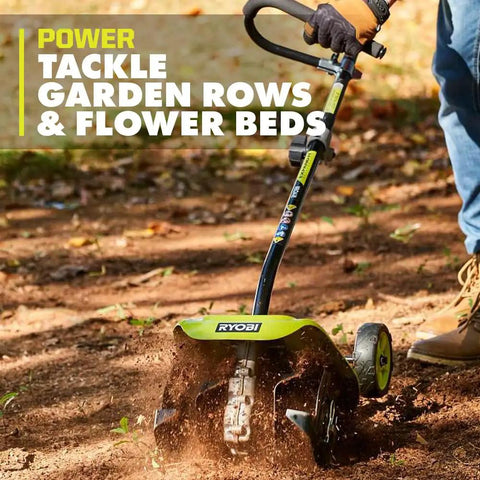 Universal Tiller Attachment For String Trimmer 8 Inch Cultivator with 4 Steel Tines used in a garden bed.