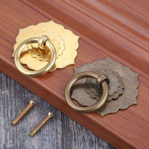Antique Brass Ring Pulls For Cabinets And Doors Hexagon Flower Design Drawer Handles with screws on wooden surface