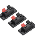 Three black Two Way Spring Terminal Clip Push Release Connector Plate Jack Socket For Speaker Terminal Strip Block Test Clip WP21, with red and black polarity coding, showing copper contacts.
