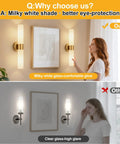 Pretty Darn Sleek Hardwired Wall Sconces Set Of Two With Thick Milky White Glass And Brushed Gold Finish illuminating a modern bathroom.