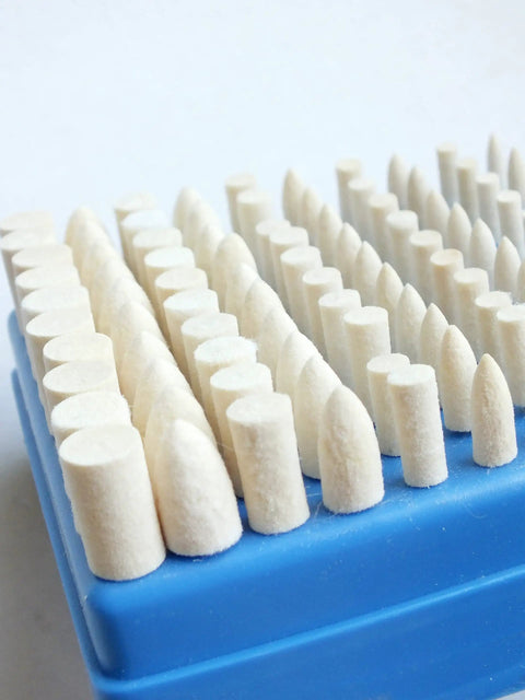 Pro Grade Wool Bobs For Rotary Tools Set Of 100 Pieces mandrel mounted on blue tray with bullet heads