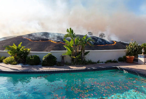 Backyard pool with fire in background, ideal for Portable Home Wildfire Protection Pump And Hose System For Backyard Pool With 12 Ft Suction Hose And Foot Valve Strainer For Easy Prime And Quick Water Defense Against Fires