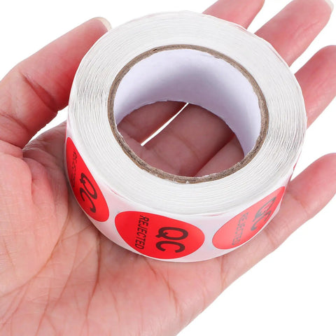Round QC Labels 1 Roll Must-Have High-Contrast Quality Control Stickers With Peeling-Resistant Coated Paper Adhesive For Production Testing, Warehouse Supplies, Inventory, And Quality Assurance. Red QC label roll in hand