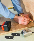 Person marking a wood panel using a pencil with Solid As Nails Table Leaf Levelers And Alignment Locks With Sliding Bars And Screws Badass Polished Steel Hardware To Fix Wobbly Tables No Sweat 20 Piece Kit For Slick Upgrades.