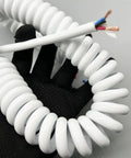 Heavy Duty Coiled Power Cord 15 AWG Pure Copper Spiral Spring Extension Cable showing flexible coiled design in hand.
