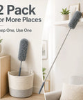 All In One 2 Pack Microfiber Feather Duster Set With Extendable Pole displayed in a basket and on a shelf in a living room