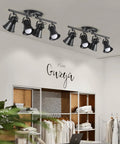 4 Light Track Lighting Kit In Industrial Black Finish With Adjustable Heads, installed in a modern room with white decor