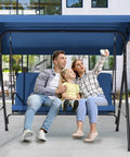 Family sitting on Three Seat Patio Swing With Removable Cushions And Adjustable Weather Resistant Canopy For Backyard Porch And Garden In Blue Fabric Seat For Outdoor Chill And Lounging