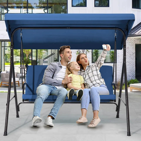 Family sitting on Three Seat Patio Swing With Removable Cushions And Adjustable Weather Resistant Canopy For Backyard Porch And Garden In Blue Fabric Seat For Outdoor Chill And Lounging